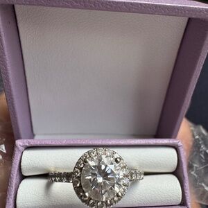 This is 18k white gold halo lab grown diamond ring